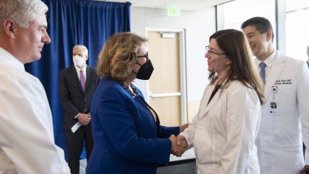 Majority Leader Reyes shaking hand with a Doctor at the AB 35 Bill Signing event