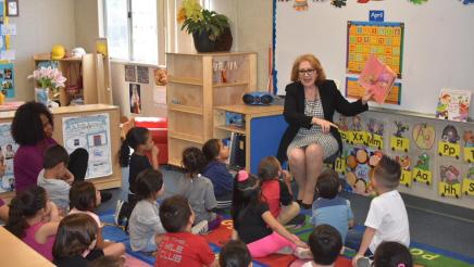 reading to students at Wilson Preschool